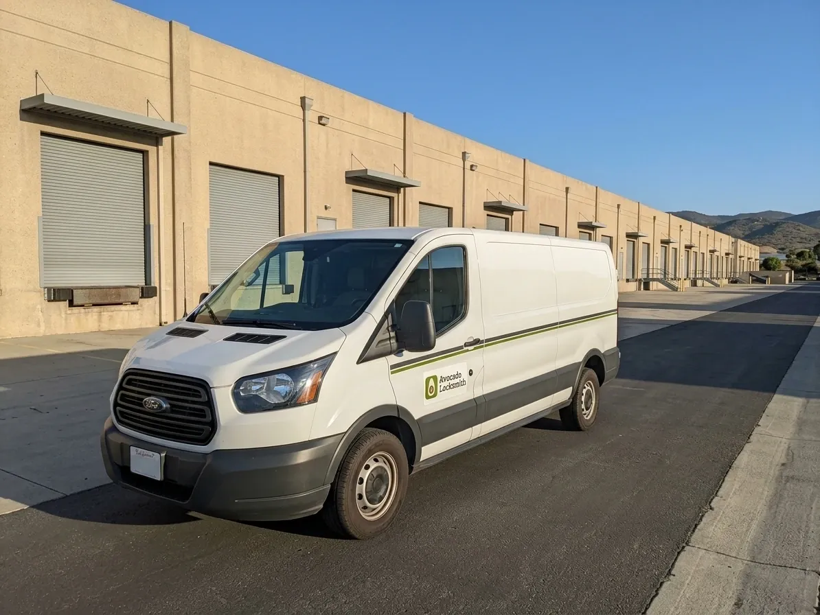 Avocado Locksmith van parked at a row of roll-up doors in the Vista Business Park